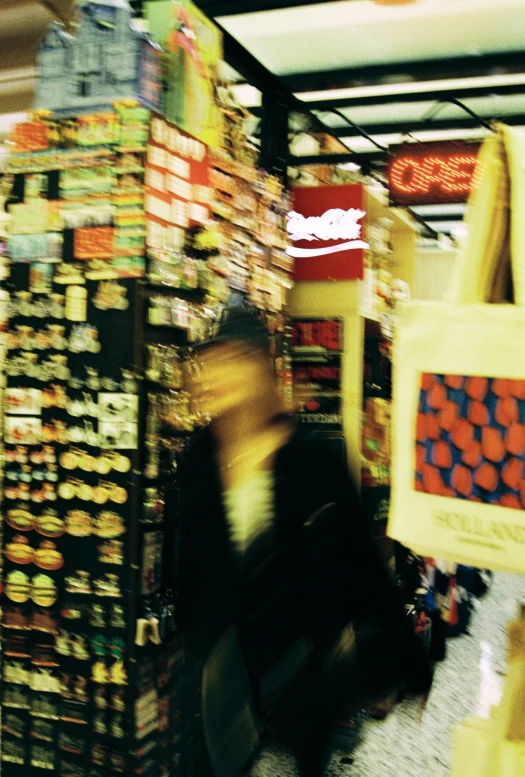 a close up of a person walking by a large number of items