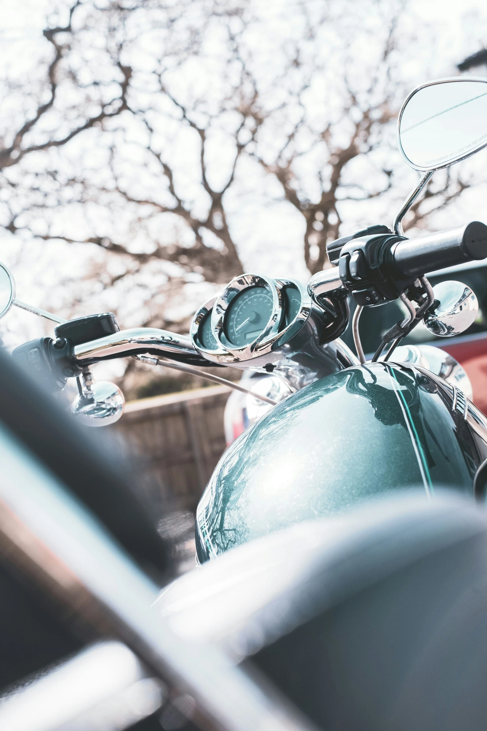 the front of a motorcycle with the headlights on