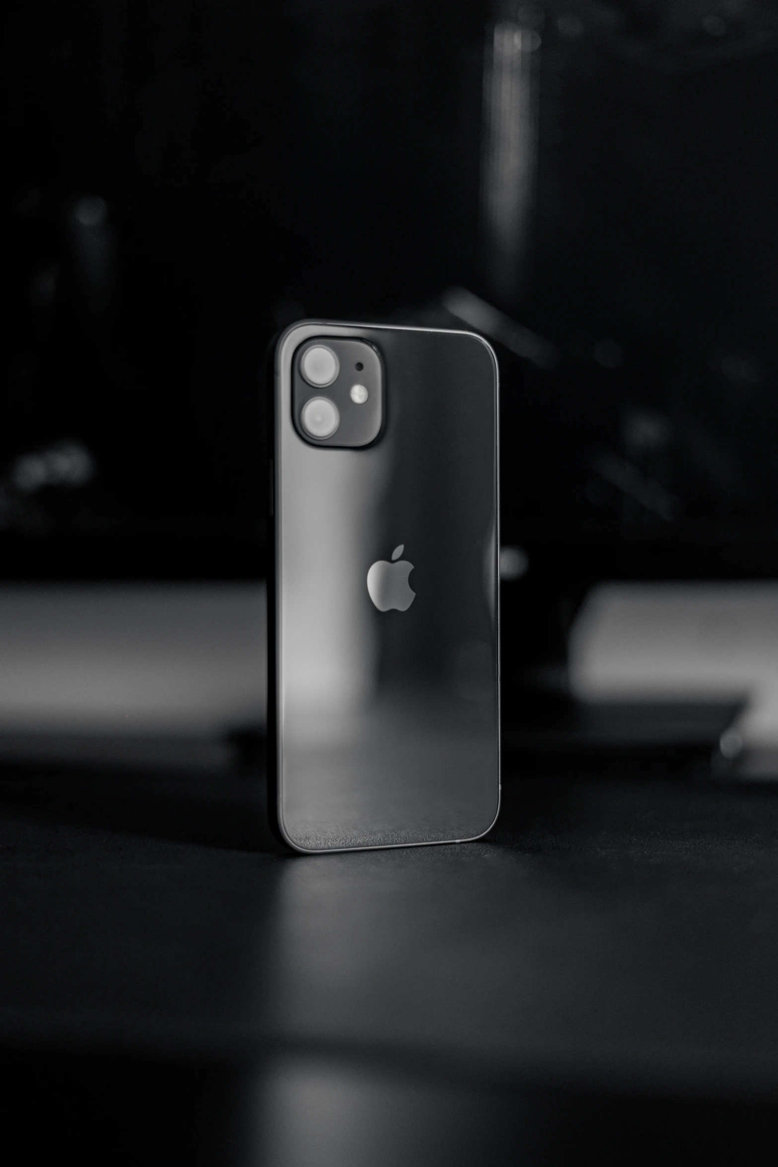 black and white po of an apple logo on a phone case