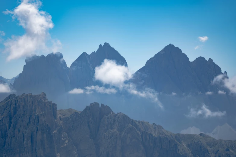 a mountain range with several large rocks sticking out of it