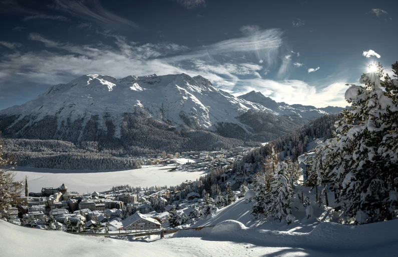 a group of skiers standing at the bottom of a mountain