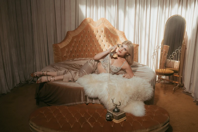 woman with a fur boa laying on her bed