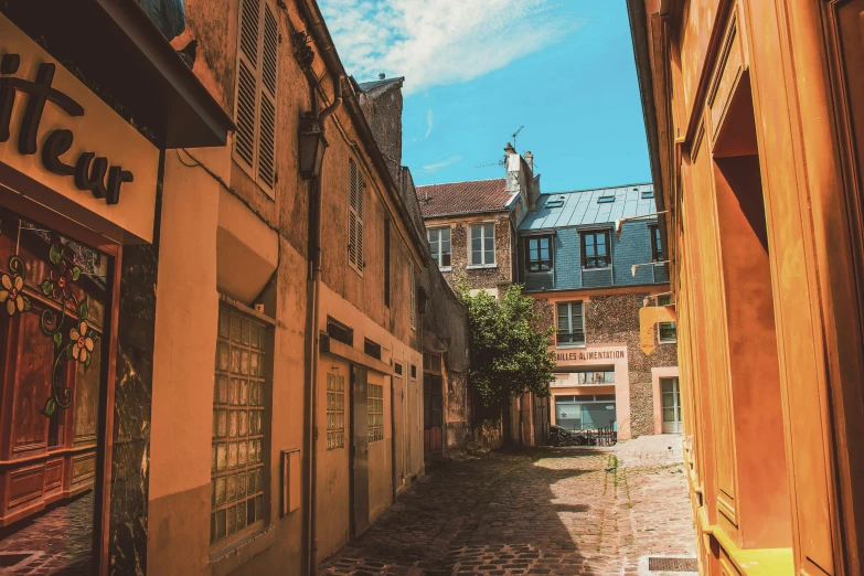 an old city street with old buildings and cobblestones