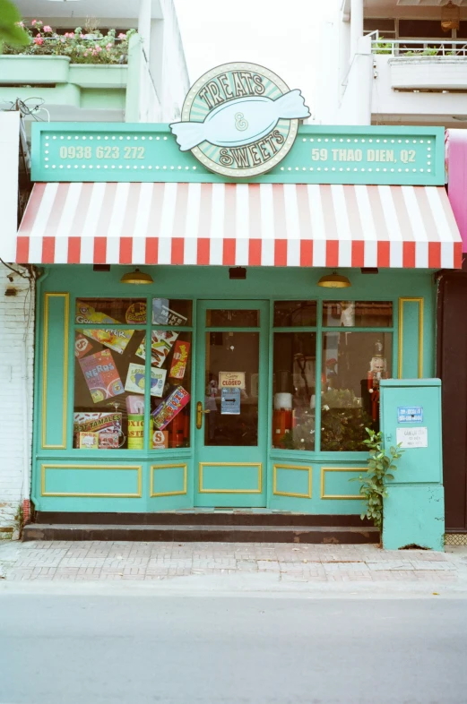 this restaurant has colorful awnings and various signs