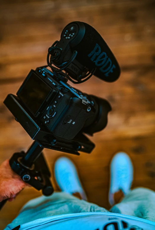 a small digital camera sitting on top of a hand