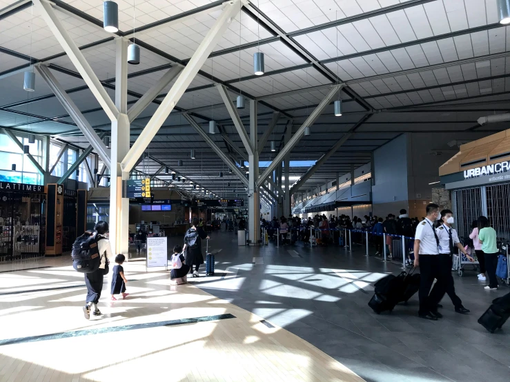 the travelers in the airport are lined up on their luggage