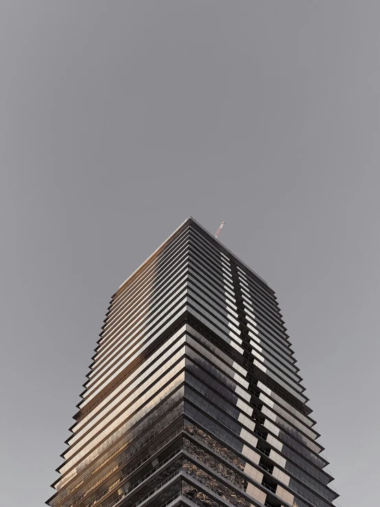 a view from below of a tall building that looks to be a skyscr