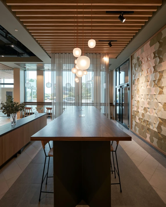 a room that has a wooden table next to chairs