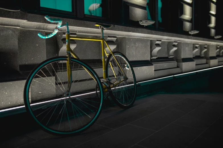 the bike is leaning against a wall near the bus