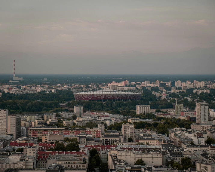 a city is seen in the distance with buildings and sky