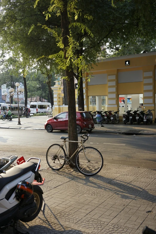 a bicycle parked on the side of a street