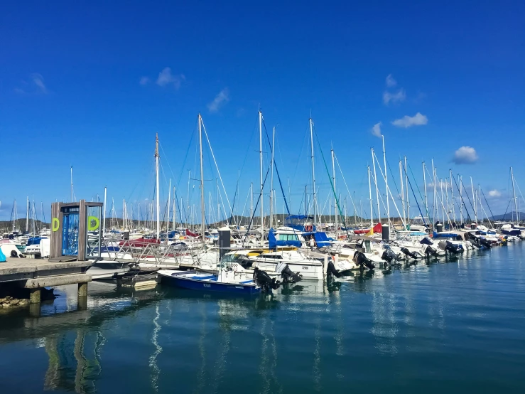 a lot of small boats are parked at the harbor