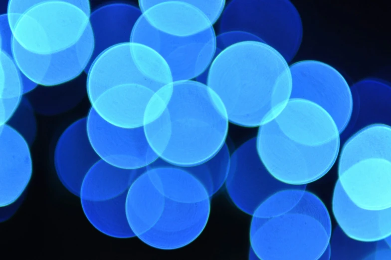 blue lights are arranged in the shape of round bubbles