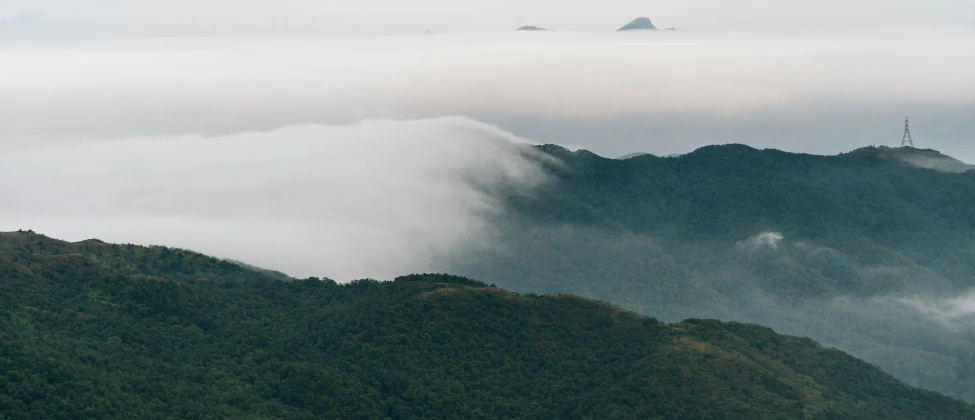 a large group of hills that are covered in clouds