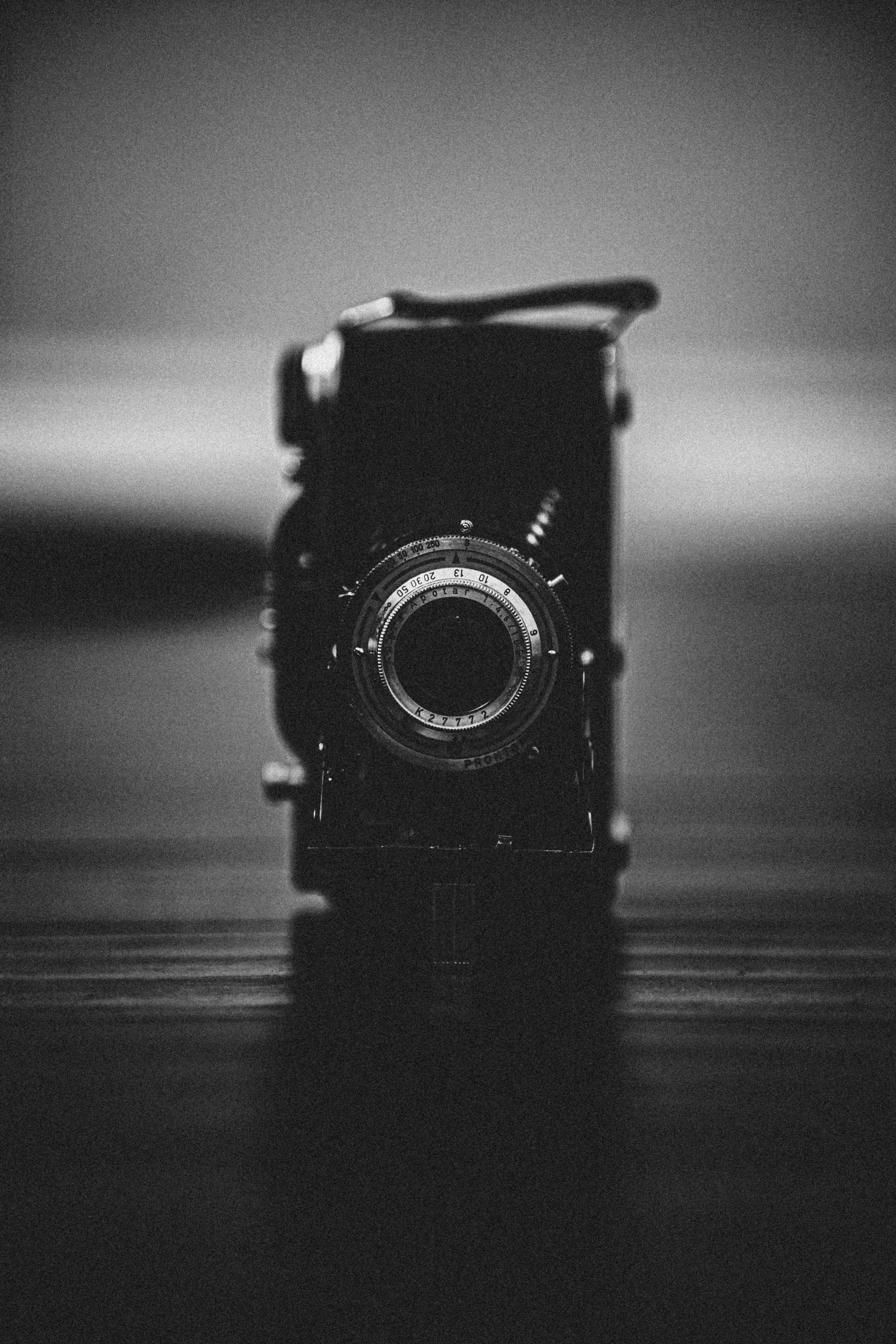 an old, vintage camera is sitting on the table