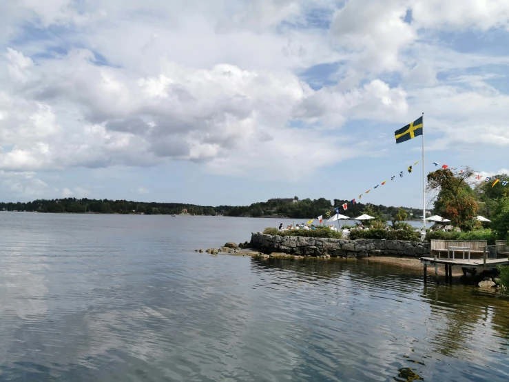 the flag is in the air above the water