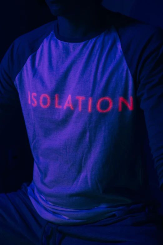 a person with a dark blue shirt and words that spell isolation