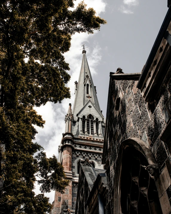 a steeple is shown from below on an old building