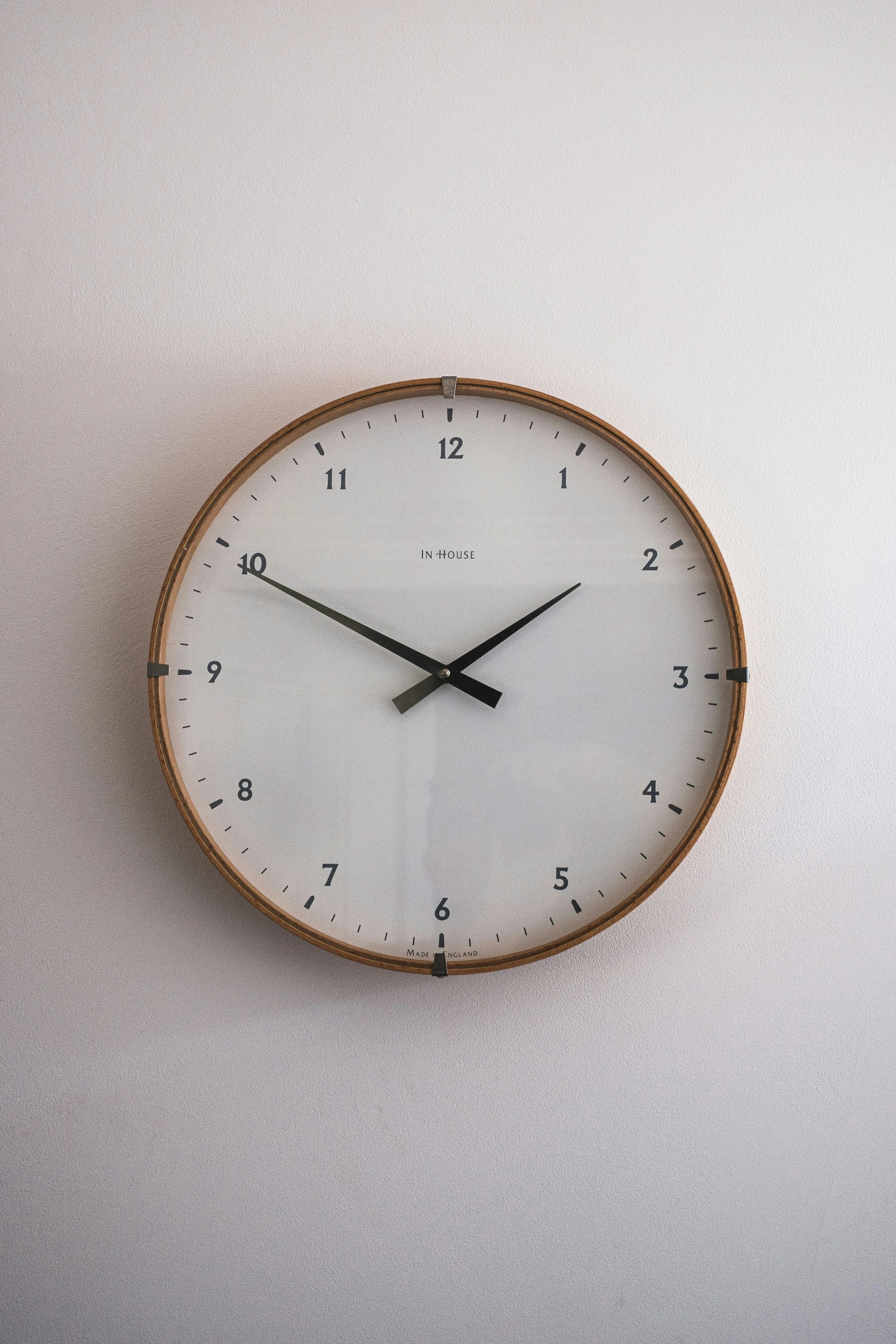 an image of a clock hanging on a wall