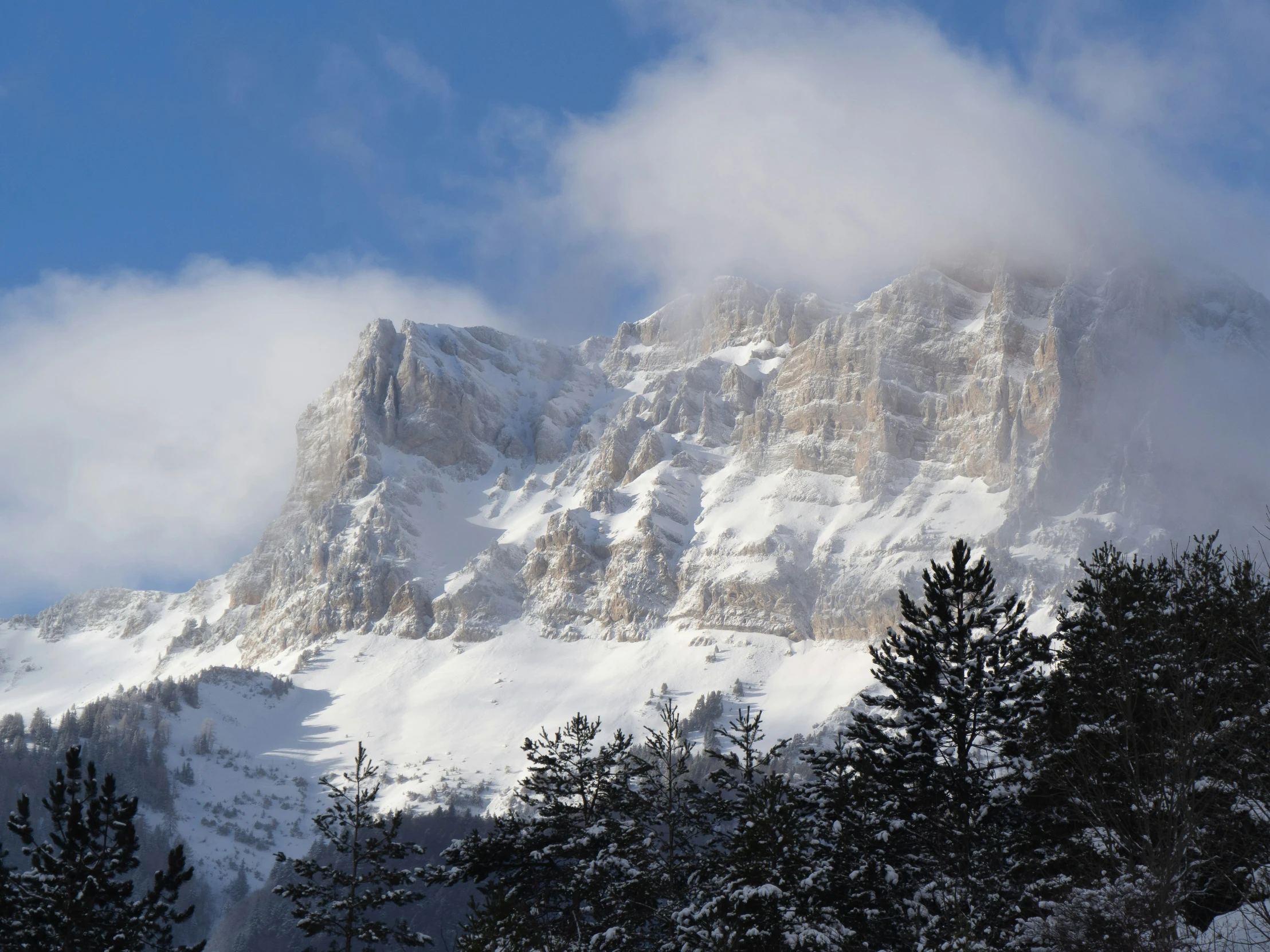 the view from a snow covered mountain peak