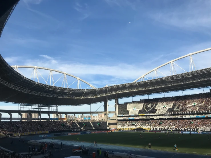 a stadium with an empty stadium and fans