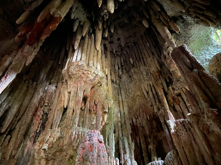 the ceiling of a cave in a mountain with stalagorts