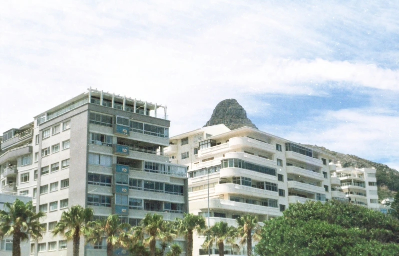 some big buildings with trees around them