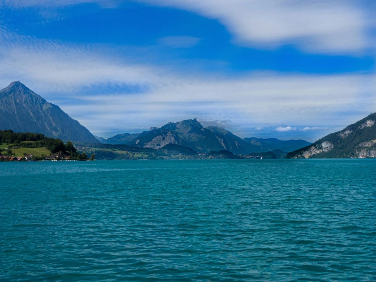 a body of water that is surrounded by mountains