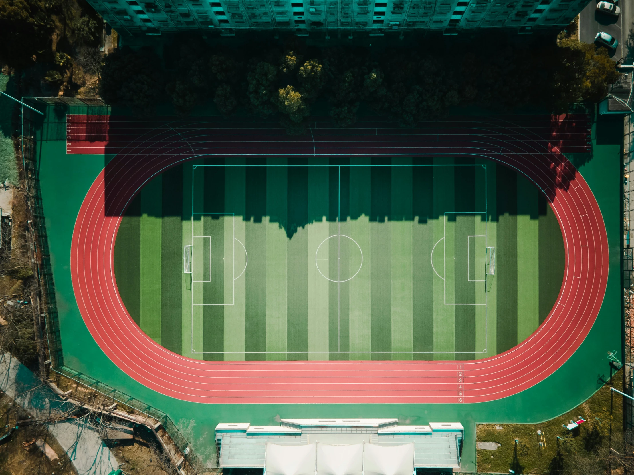 an overhead view of a stadium with running track