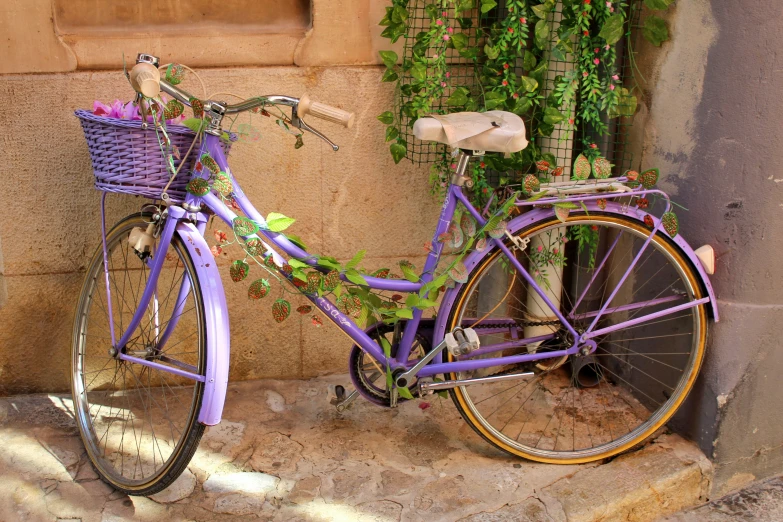 a bike is sitting up against a stone wall