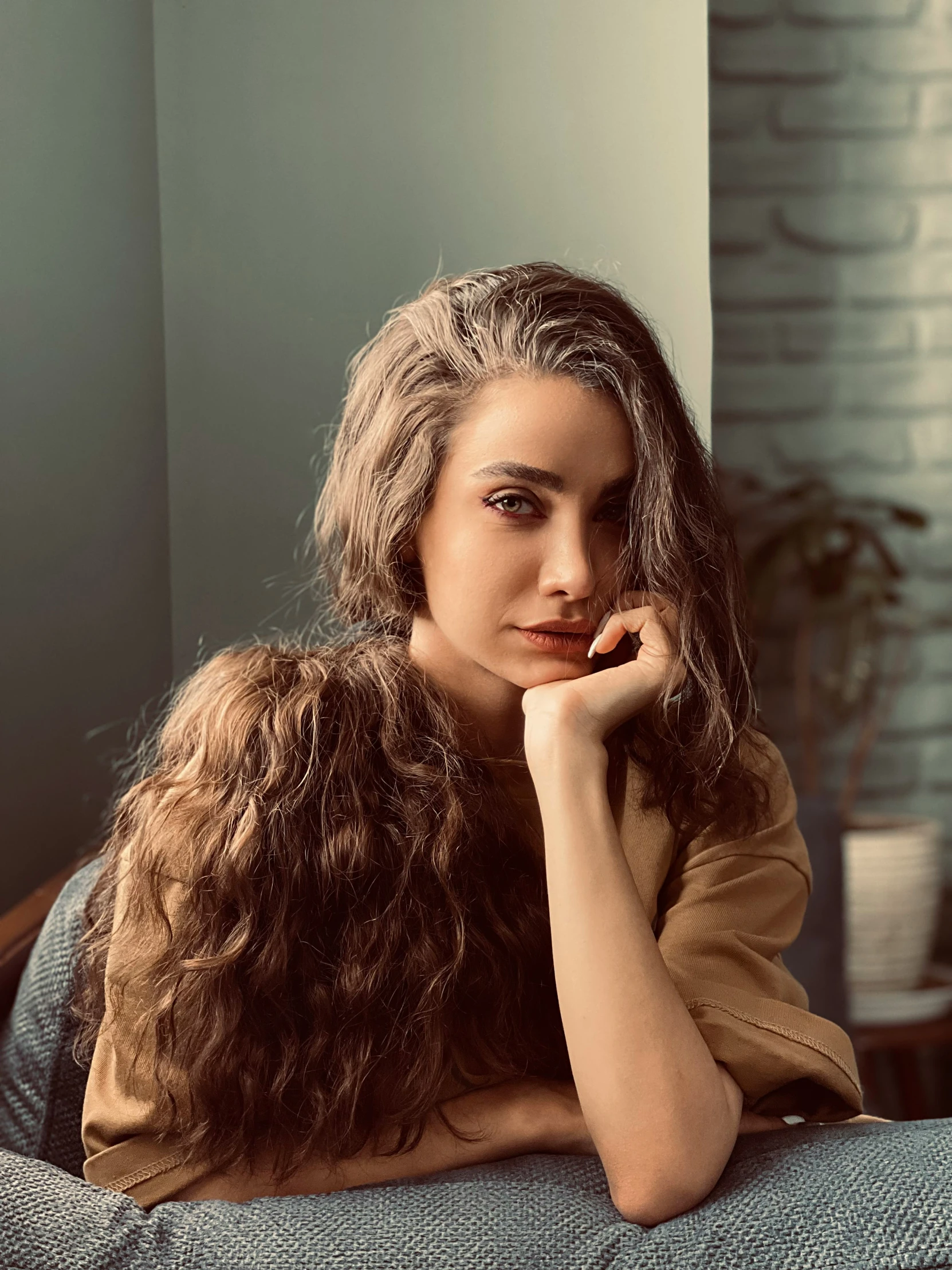 a young lady posing on the sofa