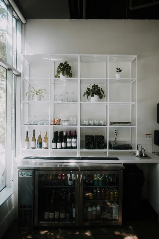 a picture of an organized kitchen with bottles