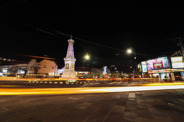 a city street with buildings and a light