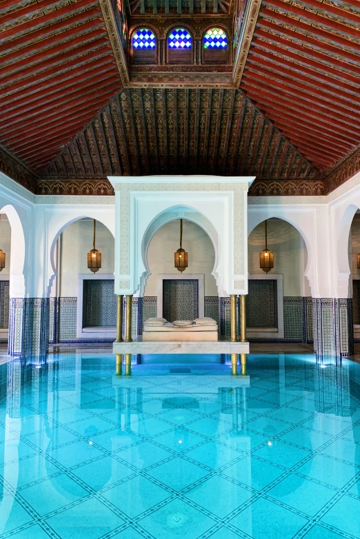 a very large and fancy blue swimming pool