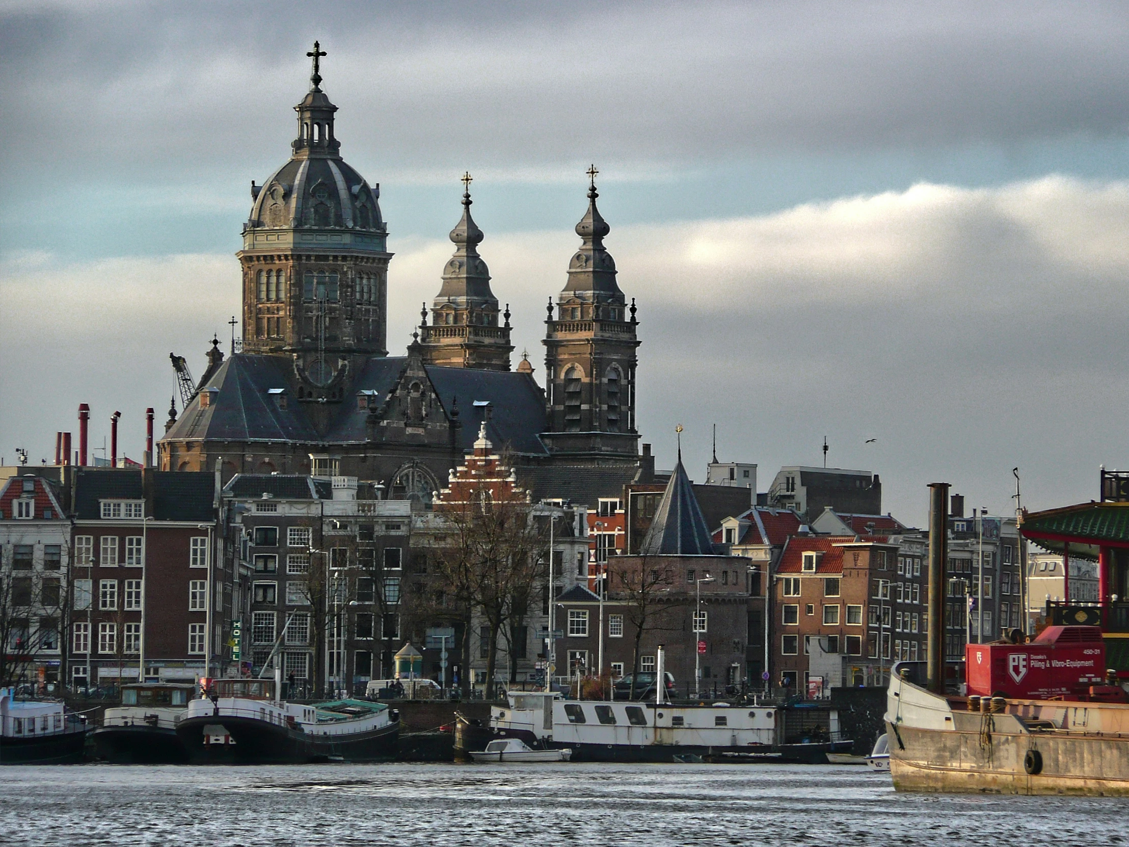 several tall buildings sitting on top of a river