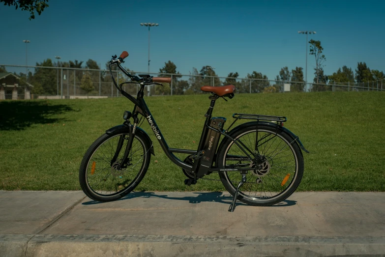 a bike with side basket sitting on sidewalk