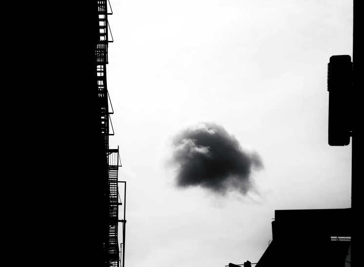 black and white image of a smoke plume in a city