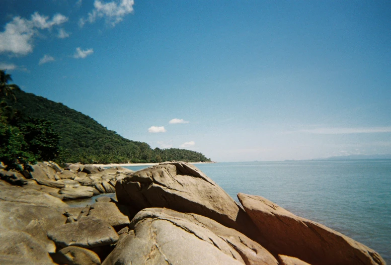 a view of the ocean and rocks along the shoreline