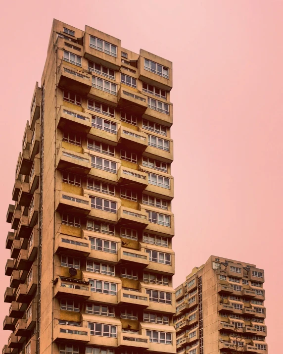 the building is yellow and has balconies