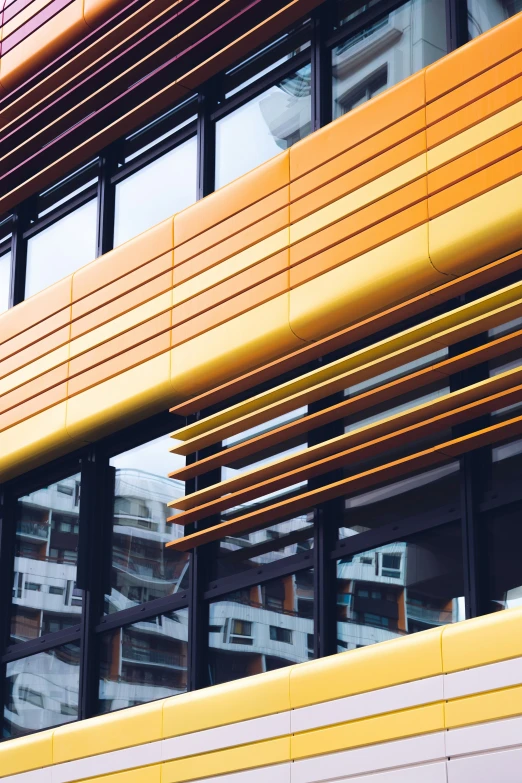 the side of an office building with a yellow roof