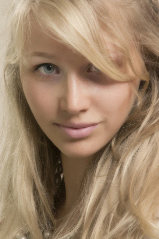 a close - up picture of a blond woman with blonde hair