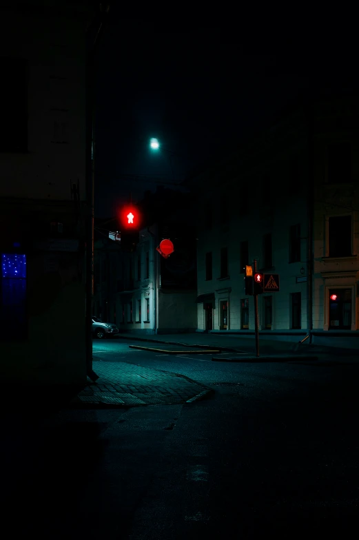 red stop lights on a city street at night