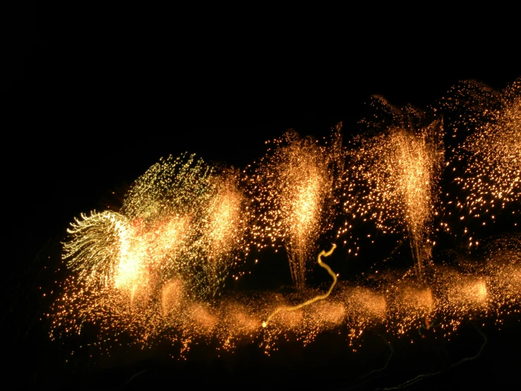 brightly colored fireworks on a dark night sky