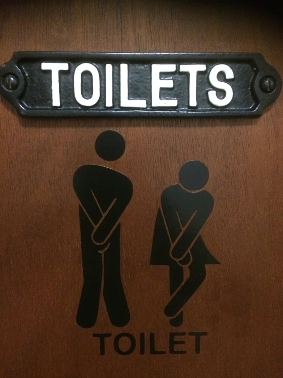 sign on toilet stall showing the public restroom