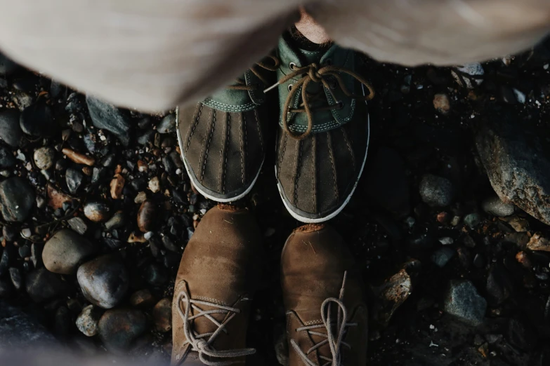 a person is walking on some rocks and a bunch of stones