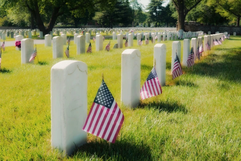 an american flag is placed next to two graves