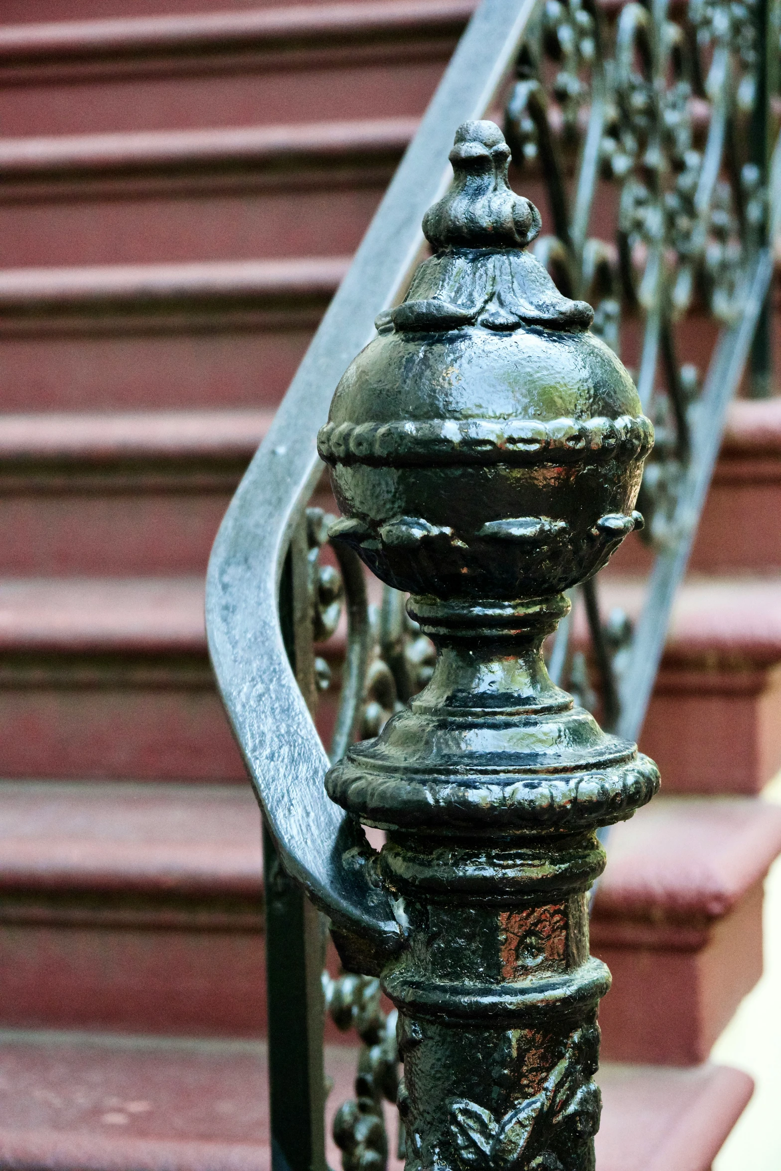 metal stair railing, with decorative ironwork on it