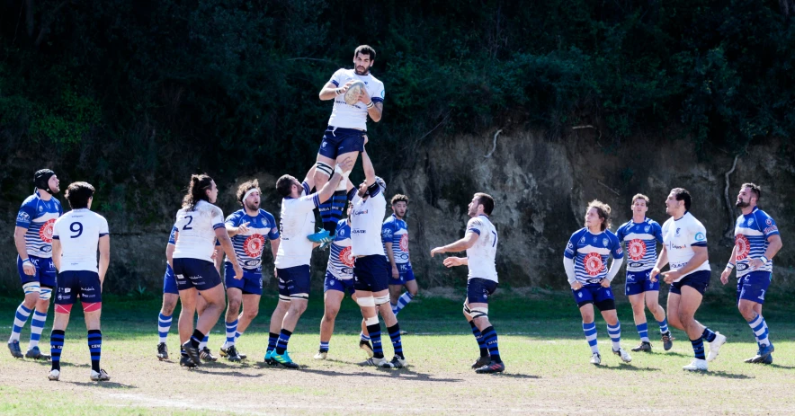 two men are jumping up and down in formation in this pograph