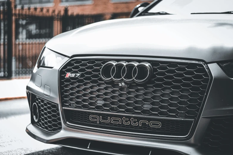 an audi sedan parked in a parking lot