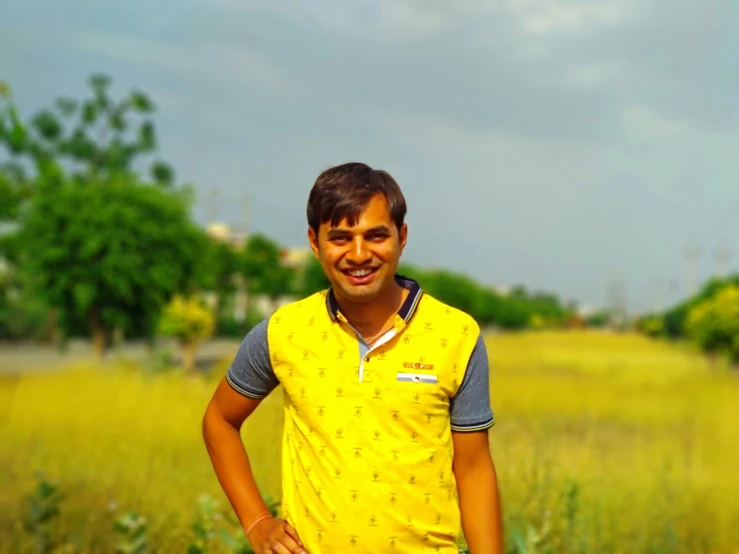 a young man in a field with a frisbee